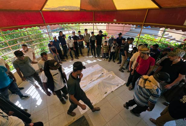 Mourners bid farewell to two Palestinians at Nasser Medical Complex Mourners bid farewell to the bodies of two Palestinians at Nasser Medical Complex in Khan Younis, southern Gaza Strip, on July 1, 2026, after they were killed in an Israeli airstrike that targeted a group of people near the Asdaa junction in the al-Mawasi area of Khan Younis the previous evening. Photo by Tariq Mohammad APA Images Khan Yunis Gaza Strip Palestinian Territory 010726_Khan_Yunis_TM_01(16) Copyright: xapaimagesxTariqxMohammad xapaimagesx