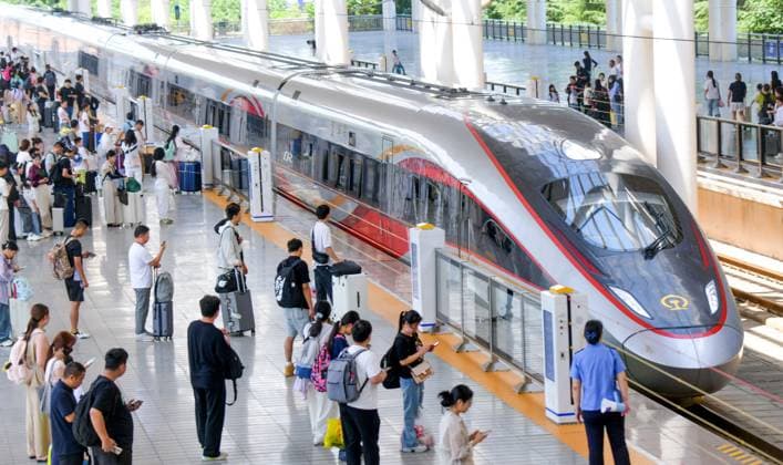LUOYANG, CHINA - JULY 01: Passengers board a Fuxing bullet train at Luoyang Longmen Railway Station on July 1, 2026 in Luoyang, Henan Province of China. China s railways have implemented a new train diagram to kick off the summer transport season.  Copyright: xVCGx 111651582417