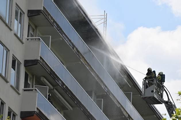 Firefighters pictured at the scene of a fire in an apartment building in the August Vermeylenlaan street in Antwerp on Wednesday 01 July 2026. According to the first information the fire broke out on the eighth level of the 10-floor building.  JONASxROOSENS 180075674