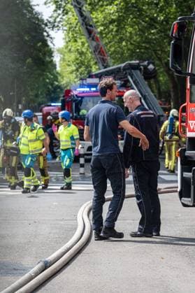 Firefighters pictured at the scene of a fire in an apartment building in the August Vermeylenlaan street in Antwerp on Wednesday 01 July 2026. According to the first information the fire broke out on the eighth level of the 10-floor building.  JONASxROOSENS 180081733