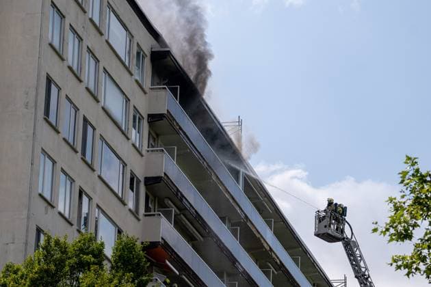 Firefighters pictured at the scene of a fire in an apartment building in the August Vermeylenlaan street in Antwerp on Wednesday 01 July 2026. According to the first information the fire broke out on the eighth level of the 10-floor building.  JONASxROOSENS 180082130