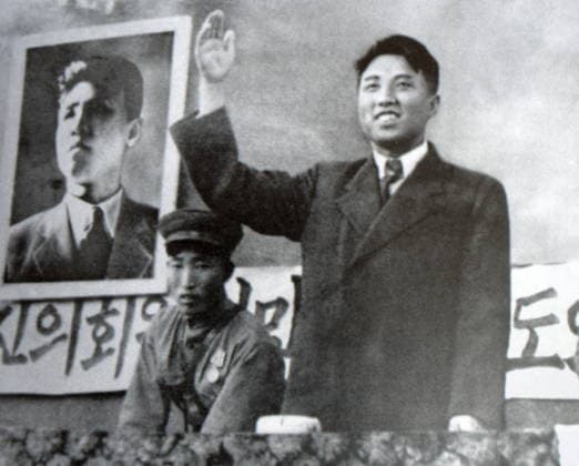 RECORD DATE NOT STATED Kim Il Sung offers greetings to voters Kim Il Sung offers greetings to voters at the rally in honor of the first elections, North Korea; October 16, 1947. Editorial use only. All other uses to be cleared with the copyright owner (World History Archive), in advance., WHA_152_0103.jpg, Kim Il Sung; greetings; voters; rally; elections; North Korea; October 16, 1947; leader; political; campaign; propaganda; historical; vintage; black and white; crowd; cheering; democracy; communist; socialist; regime; dictatorship; public event; historical figure; Korean history; 1940s; Asia; East Asia; Korean War; Korean Peninsula; totalitarianism; dictatorship. Copyright: xWorldxHistoryxArchivex