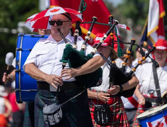 (260701) -- TORONTO, July 1, 2026 -- A pipe band performs during the 2026 Canada Day Parade in Toronto, Canada, July 1, 2026. (Photo by Zou Zheng Xinhua) CANADA-TORONTO-CANADA DAY-PARADE LinxWei 