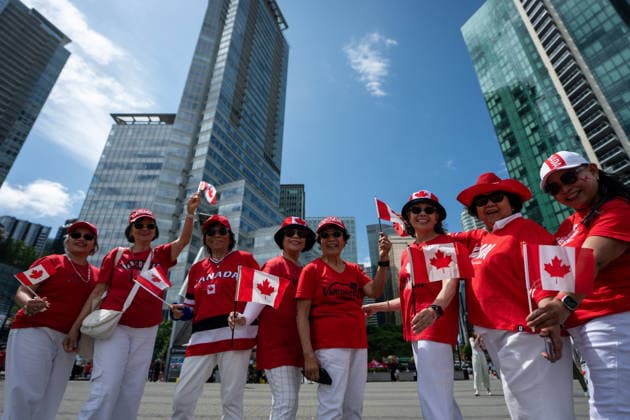 July 1, 2026, Vancouver, Bc, CANADA: People pose for a photo during Canada Day Celebrations in Vancouver, on Wednesday, July 1, 2026. Vancouver CANADA  - ZUMAc35_ 20260701_zaf_c35_081 Copyright: xEthanxCairnsx