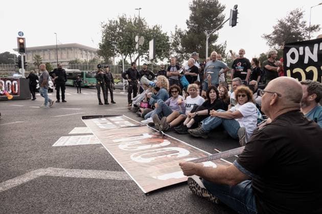 July 2, 2026, Jerusalem, Israel: Anti government protesters deploy a massive crate to block the main intersection outside the Knesset during a nationwide Day of Rage. Activists gathered at exactly 6:29 a.m. to mark the 1,000th day since the October 7, 2023 attacks, which they have dubbed the Netanyahu Massacre, demanding accountability for the government s failure to prevent the initial attacks, secure the release of all hostages alive, the ongoing 3 year war and for establishing a state commission of inquiry. Jerusalem Israel - ZUMAa126 20260702_zap_a126_015 Copyright: xNirxAlonx