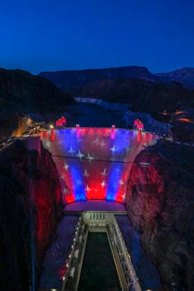 July 1, 2026 - Boulder City, Nevada, U.S. - Patriotic lighting illuminates the Hoover Dam on July 1, 2026 in the Lake Mead National Recreation Area, near Boulder City, Nevada. The dam will be lit through July 4, 2026 to mark the 250th anniversary of the United States Declaration of Independence. Boulder City USA - ZUMAbk3_ 20260701_zaf_bk3_001 Copyright: xDavidxBeckerx