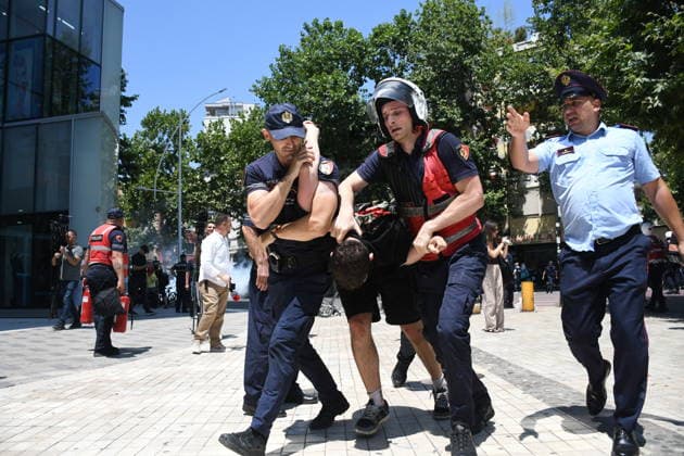 Protest over Zvernec Tourism Project held outside Albanian Parliament TIRANA, ALBANIA - JULY 2: Demonstrators protesting a planned tourism development project in the Zvernec area of Vlora gather outside the Albanian Parliament in Tirana on July 2, 2026, as protests that have continued for more than a month entered a new phase. Scuffles broke out between police and protesters during the demonstration. Protesters threw eggs and flour at police officers, members of parliament and parliamentary vehicles. Olsi Shehu Anadolu Tirana Albania. Editorial use only. Please get in touch for any other usage.  Copyright: x2026xAnadoluxOlsixShehux