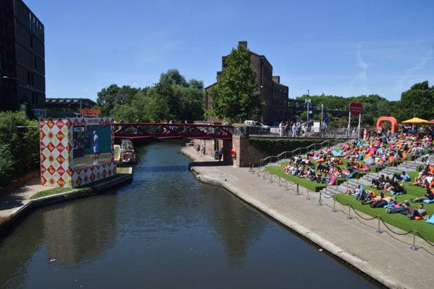 July 2, 2026, London, England, United Kingdom: People watch Wimbledon tennis matches on the large Everyman On The Canal screen in Granary Square next to Regent s Canal in King s Cross. The cinema chain sets up the screen, beanbags, a bar, and free sport and film screenings during the summer months. London United Kingdom - ZUMAv130 20260702_zip_v130_023 Copyright: xVukxValcicx