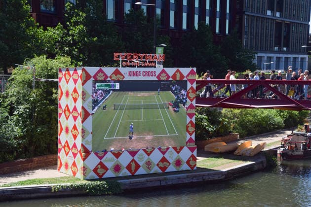 July 2, 2026, London, England, United Kingdom: People watch Wimbledon tennis matches on the large Everyman On The Canal screen in Granary Square next to Regent s Canal in King s Cross. The cinema chain sets up the screen, beanbags, a bar, and free sport and film screenings during the summer months. London United Kingdom - ZUMAv130 20260702_zip_v130_027 Copyright: xVukxValcicx
