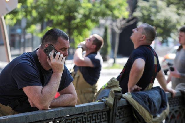 RECORD DATE NOT STATED A man talks on the phone at the scene of a hotel building damaged in a massive Russian missile and drone attack in the Shevchenkivskyi district of Kyiv, Ukraine, on July 2, 2026. The Russian military launched a massive attack on the city using attack drones and various types of missiles. At least 13 people were killed and 56 others were injured in the strike. Private homes, apartment buildings, an ambulance substation and a hotel building were damaged (Photo by Hennadii Minchenko Ukrinform) Downtown Kyiv hotel damaged in Russian attack  Copyright: xHennadiixMinchenkox