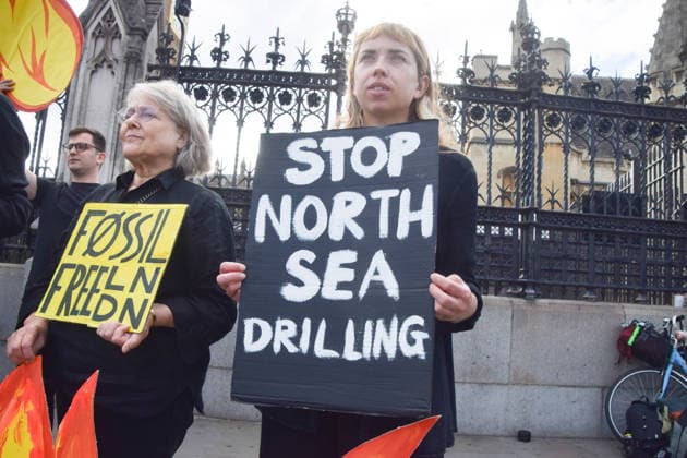 July 2, 2026, London, England, United Kingdom: Activists from Fossil Free London stage a protest outside the parliament calling on Andy Burnham, who is expected to become the next UK Prime Minister, not to open the North Sea to oil and gas projects like Jackdaw and Rosebank. London United Kingdom - ZUMAv130 20260702_zip_v130_043 Copyright: xVukxValcicx