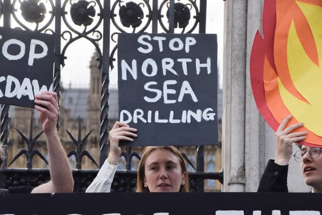 July 2, 2026, London, England, United Kingdom: Activists from Fossil Free London stage a protest outside the parliament calling on Andy Burnham, who is expected to become the next UK Prime Minister, not to open the North Sea to oil and gas projects like Jackdaw and Rosebank. London United Kingdom  - ZUMAv130 20260702_zip_v130_045 Copyright: xVukxValcicx