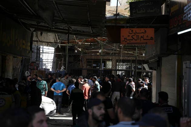 Damascus Cafe Blast Aftermath Investigated Syrian security personnel and members of the public gather in a commercial passage outside a cordoned-off cafe in central Damascus, Syria, on July 2, 2026. An explosive device detonated inside a cafe in the al-Hijaz area near the Palace of Justice, killing people and injuring others, Syrian authorities said. Damascus Damascus Syria Copyright: xOmarxAlbamx