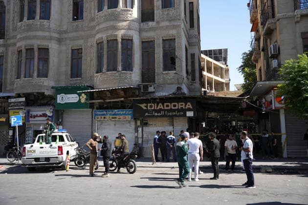 Damascus Cafe Blast Aftermath Investigated Syrian security personnel and members of the public gather in a commercial passage outside a cordoned-off cafe in central Damascus, Syria, on July 2, 2026. An explosive device detonated inside a cafe in the al-Hijaz area near the Palace of Justice, killing people and injuring others, Syrian authorities said. Damascus Damascus Syria Copyright: xOmarxAlbamx
