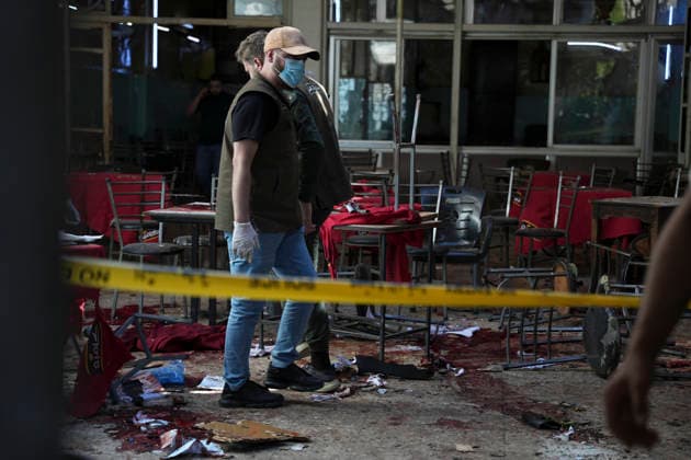 Damascus Cafe Blast Aftermath Investigated A man wearing gloves walks through the damaged interior of a cafe in central Damascus, Syria, on July 2, 2026. An explosive device detonated inside a cafe in the al-Hijaz area near the Palace of Justice, killing people and injuring others, Syrian authorities said. Damascus Damascus Syria Copyright: xOmarxAlbamx