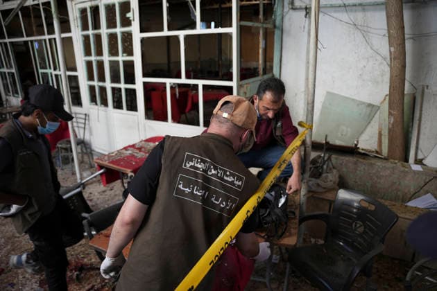 Damascus Cafe Blast Aftermath Investigated Forensic investigators examine items behind police tape inside a cafe in central Damascus, Syria, on July 2, 2026. An explosive device detonated inside the cafe near the Palace of Justice in the al-Hijaz area, killing people and injuring others, Syrian authorities said. Damascus Damascus Syria Copyright: xOmarxAlbamx