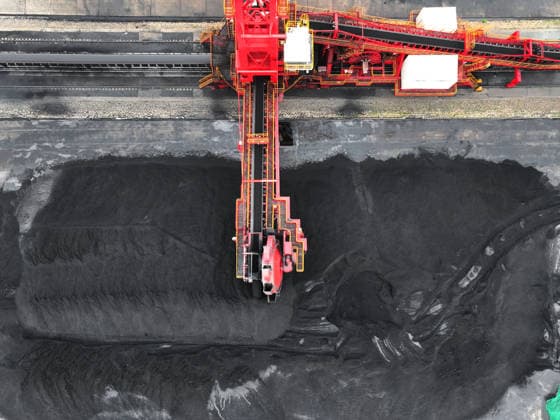 Lianyungang Port Coal Terminal LIANYUNGANG, CHINA - JULY 3, 2026 - Large machinery is stacking and storing imported coal at the coal terminal yard of Lianyungang Port in Jiangsu Province, China on July 3, 2026. Lianyungang Jiangsu China  Copyright: xCFOTOx i1783069298813