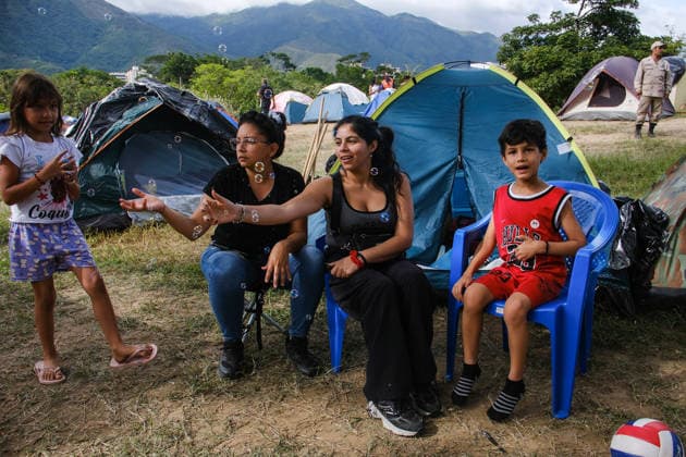 Earthquake-displaced families take shelter in an open-door temporary facility in Caracas CARACAS, VENEZUELA - JULY 2: Various volunteer groups organize recreational activities for children and young people as dozens of families displaced by the twin earthquakes that struck the country are finding a place to sleep, eat, and take shelter while trying to decide what to do next after losing their homes in Caracas, Venezuela, on July 2, 2026. It is an open-door temporary shelter: arrivals can stay for a night or several days, and are free to leave to look for relatives or try to resolve their situation. Around 500 families are currently settled in this shelter. Most come from various devastated areas of the capital, though families have also arr  Copyright: x2026xAnadoluxDikoxBetancourtx