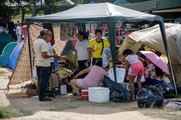 Earthquake-displaced families take shelter in an open-door temporary facility in Caracas CARACAS, VENEZUELA - JULY 2: Various volunteer groups organize recreational activities for children and young people as dozens of families displaced by the twin earthquakes that struck the country are finding a place to sleep, eat, and take shelter while trying to decide what to do next after losing their homes in Caracas, Venezuela, on July 2, 2026. It is an open-door temporary shelter: arrivals can stay for a night or several days, and are free to leave to look for relatives or try to resolve their situation. Around 500 families are currently settled in this shelter. Most come from various devastated areas of the capital, though families have also arr  Copyright: x2026xAnadoluxDikoxBetancourtx