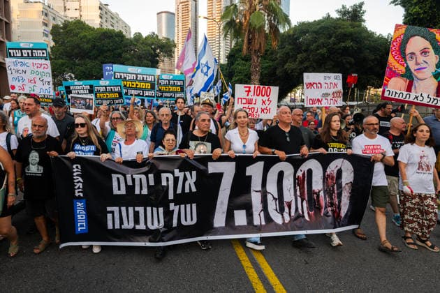 July 2, 2026, Tel Aviv, Israel: Protesters hold a banner and placards during an anti-government rally. A rally was held to mark 1,000 days since the October 7 massacre. Demonstrators protested against the Israeli government, accusing it of responsibility for the failures that led to the attack and calling for a state commission of inquiry, which they say the government opposes because its findings could implicate Prime Minister Benjamin Netanyahu. Tel Aviv Israel - ZUMAs197 20260702_aaa_s197_311 Copyright: xYaelxGuiskyxAbasx
