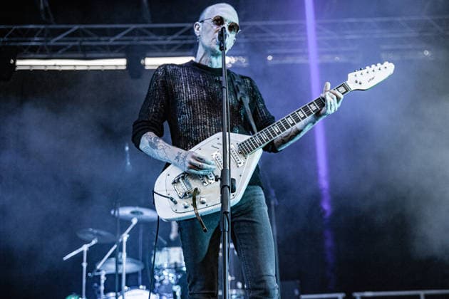 July 2, 2026, Soliera, Emilia Romagna, Italy: Singer and guitarist Craig Dyer of the British post-punk band The Underground Youth performs on stage during a concert. Singer and guitarist Craig Dyer performed on stage at Piazza Lusvardi in Soliera (Modena) during a concert by British post-punk band The Underground Youth. The event marked the opening night of the nineteenth edition of the Arti Vive Festival. Soliera Italy - ZUMAs197 20260702_aaa_s197_414 Copyright: xCarloxVerganix