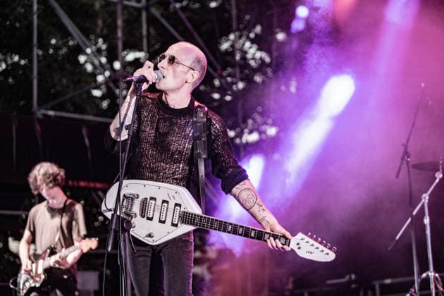 July 2, 2026, Soliera, Emilia Romagna, Italy: Singer and guitarist Craig Dyer of the British post-punk band The Underground Youth performs on stage during a concert. Singer and guitarist Craig Dyer performed on stage at Piazza Lusvardi in Soliera (Modena) during a concert by British post-punk band The Underground Youth. The event marked the opening night of the nineteenth edition of the Arti Vive Festival. Soliera Italy  - ZUMAs197 20260702_aaa_s197_424 Copyright: xCarloxVerganix