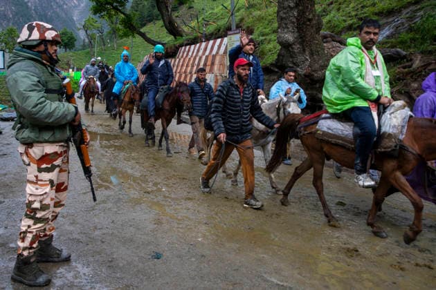Annual Hindu Pilgrimage Amarnath Yatra begins in Baltal Sonamarg, India - 03 Jul 2026 An India paramilitary soldier seen on guard as Hindu devotees make their way on foot, ride horses and are carried by porters along a mountain path during the annual Amarnath pilgrimage to the cave shrine in Baltal some 100 km (62 miles) east of Srinagar. Thousands of Hindu pilgrims braving sub-zero temperatures begin the annual Amarnath Yatra trekking across glaciers, steep mountain trails and high altitude terrain to reach the sacred Amarnath cave shrine in the Himalayas of Indian-administered Kashmir. The cave houses a naturally formed ice stalagmite revered by devotees as a symbol of Lord Shiva, one of Hinduism s principal deities. The pilgrimage, which Copyright: xFaisalxBashirx xSOPAxImagesx 6AmarnathPilgrimage2026