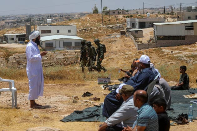 Palestinians hold Friday prayers on open land in West Bank to reaffirm their attachment to their land HEBRON, WEST BANK, PALESTINE - JULY 3: Palestinians perform Friday prayers on open land in the Hillat al-Hums area of Hebron, West Bank, on July 3, 2026. By praying on land where Israeli settlers recently erected tents nearby, Palestinians reaffirm their attachment to their land and their determination not to leave it, as Israeli soldiers maintain a presence in the area. Mamoun Wazwaz Anadolu Hebron West Bank. Editorial use only. Please get in touch for any other usage.  Copyright: x2026xAnadoluxMamounxWazwazx