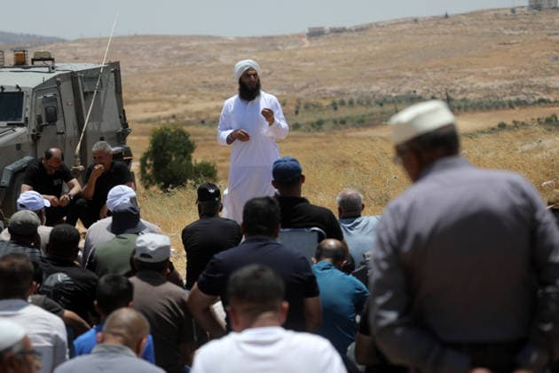 Palestinians hold Friday prayers on open land in West Bank to reaffirm their attachment to their land HEBRON, WEST BANK, PALESTINE - JULY 3: Palestinians perform Friday prayers on open land in the Hillat al-Hums area of Hebron, West Bank, on July 3, 2026. By praying on land where Israeli settlers recently erected tents nearby, Palestinians reaffirm their attachment to their land and their determination not to leave it, as Israeli soldiers maintain a presence in the area. Mamoun Wazwaz Anadolu Hebron West Bank. Editorial use only. Please get in touch for any other usage.  Copyright: x2026xAnadoluxMamounxWazwazx