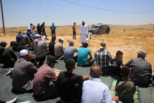 Palestinians hold Friday prayers on open land in West Bank to reaffirm their attachment to their land HEBRON, WEST BANK, PALESTINE - JULY 3: Palestinians perform Friday prayers on open land in the Hillat al-Hums area of Hebron, West Bank, on July 3, 2026. By praying on land where Israeli settlers recently erected tents nearby, Palestinians reaffirm their attachment to their land and their determination not to leave it, as Israeli soldiers maintain a presence in the area. Mamoun Wazwaz Anadolu Hebron West Bank. Editorial use only. Please get in touch for any other usage.  Copyright: x2026xAnadoluxMamounxWazwazx