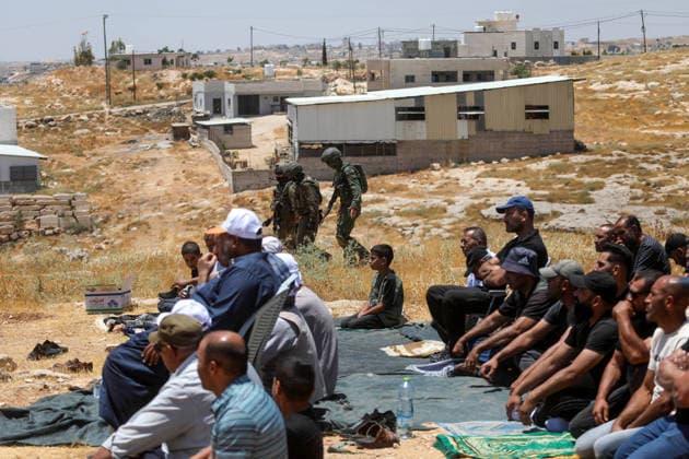 Palestinians hold Friday prayers on open land in West Bank to reaffirm their attachment to their land HEBRON, WEST BANK, PALESTINE - JULY 3: Palestinians perform Friday prayers on open land in the Hillat al-Hums area of Hebron, West Bank, on July 3, 2026. By praying on land where Israeli settlers recently erected tents nearby, Palestinians reaffirm their attachment to their land and their determination not to leave it, as Israeli soldiers maintain a presence in the area. Mamoun Wazwaz Anadolu Hebron West Bank. Editorial use only. Please get in touch for any other usage.  Copyright: x2026xAnadoluxMamounxWazwazx