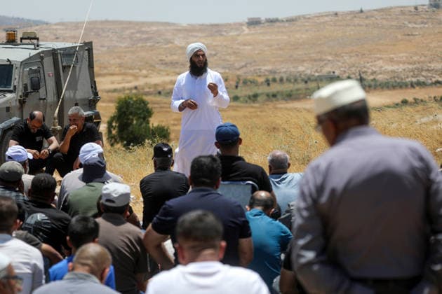 Palestinians hold Friday prayers on open land in West Bank to reaffirm their attachment to their land HEBRON, WEST BANK, PALESTINE - JULY 3: Palestinians perform Friday prayers on open land in the Hillat al-Hums area of Hebron, West Bank, on July 3, 2026. By praying on land where Israeli settlers recently erected tents nearby, Palestinians reaffirm their attachment to their land and their determination not to leave it, as Israeli soldiers maintain a presence in the area. Mamoun Wazwaz Anadolu Hebron West Bank. Editorial use only. Please get in touch for any other usage.  Copyright: x2026xAnadoluxMamounxWazwazx