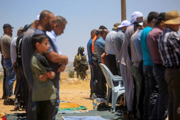 Palestinians hold Friday prayers on open land in West Bank to reaffirm their attachment to their land HEBRON, WEST BANK, PALESTINE - JULY 3: Palestinians perform Friday prayers on open land in the Hillat al-Hums area of Hebron, West Bank, on July 3, 2026. By praying on land where Israeli settlers recently erected tents nearby, Palestinians reaffirm their attachment to their land and their determination not to leave it, as Israeli soldiers maintain a presence in the area. Mamoun Wazwaz Anadolu Hebron West Bank. Editorial use only. Please get in touch for any other usage.  Copyright: x2026xAnadoluxMamounxWazwazx