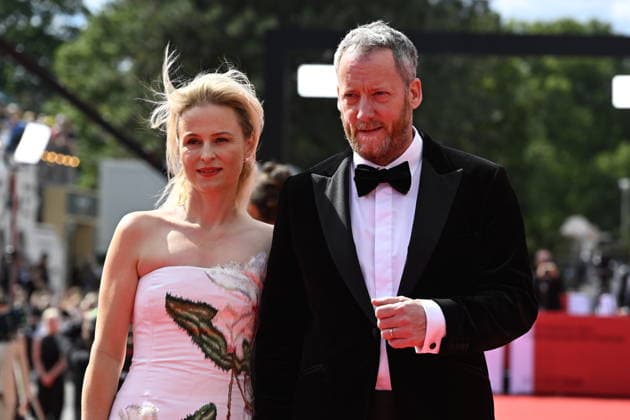 Executive Director of the festival Krystof Mucha, right, and his wife Darina Muchova, left, arrive at the opening of the 60th Karlovy Vary International Film Festival, on June 3, 2026, in Karlovy Vary, Czech Republic. (CTKxPhoto KaterinaxSulova) CTKPhotoP2026070306154  CTKPhotoP2026070306154