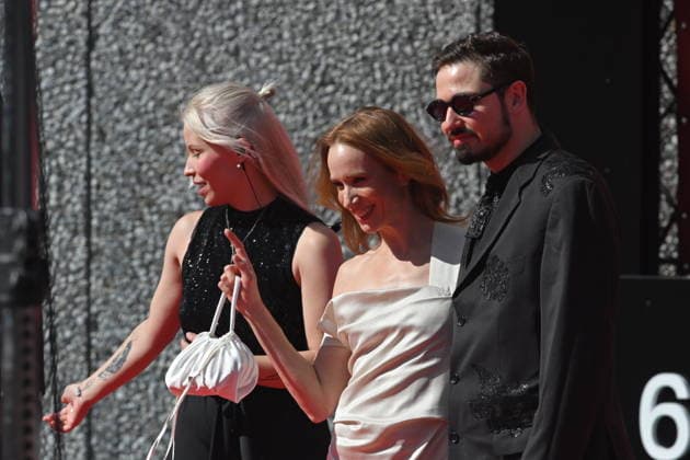 Slovak actress Tana Pauhofova, middle, and her husband, musician Jonatan Pastircak, right, arrive at the opening of the 60th Karlovy Vary International Film Festival, on June 3, 2026, in Karlovy Vary, Czech Republic. (CTKxPhoto SlavomirxKubes) CTKPhotoP2026070306331  CTKPhotoP2026070306331