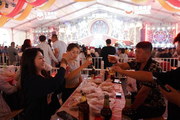 HARBIN, CHINA - JULY 03: Citizens drink beer inside a tent during the opening of the 24th Harbin International Beer Festival at Harbin Ice-Snow World on July 3, 2026 in Harbin, Heilongjiang Province of China. The festival features eight functional zones including five beer tents and 11 international beer gardens.  Copyright: xChinaxNewsxServicex 111652053386
