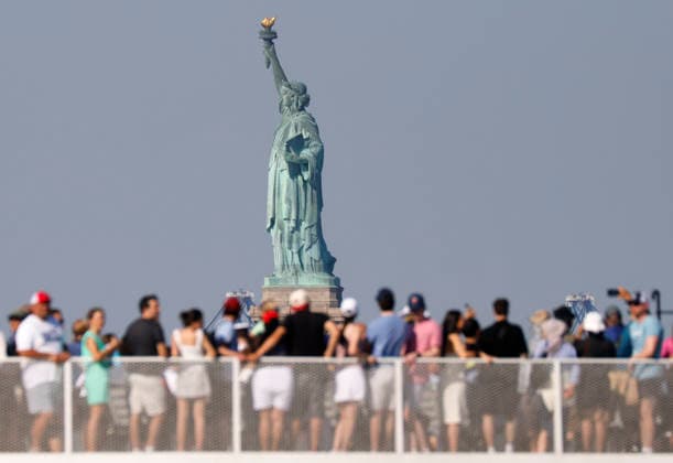 A Statue City Cruises ferry packed with sightseers passes by the Statue of Liberty one day before the July 4th holiday and the 250th anniversary of the United States on Friday July 3, 2026 in New York City.  NYP20260703911 JOHNxANGELILLO
