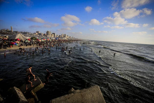 Palestinians flock to the coastline seeking relief from the heat GAZA CITY, GAZA, PALESTINE - JULY 03: As Israel s attacks on the Gaza Strip continues and soaring temperatures intensifies already harsh living conditions, Palestinians flock to the coastline seeking relief in Gaza City, Gaza, Palestine on July 03, 2026. Escaping the sweltering heat inside their tents, many sought relief by swimming off the coast of Gaza City, hoping to cool off and briefly escape the hardships of war. Saeed M. M. T. Jaras Anadolu Gaza City Gaza. Editorial use only. Please get in touch for any other usage.  Copyright: x2026xAnadoluxSaeedxM.xM.xT.xJarasx
