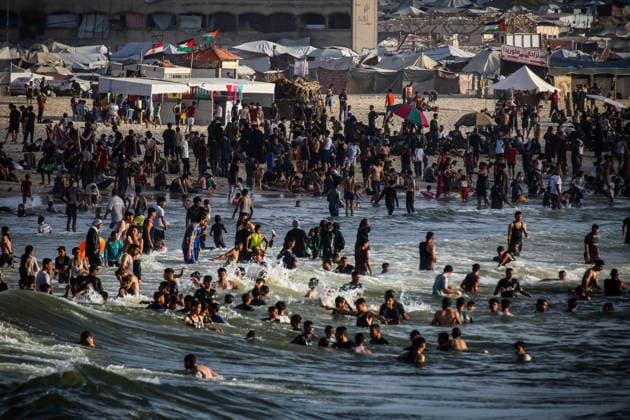 Palestinians flock to the coastline seeking relief from the heat GAZA CITY, GAZA, PALESTINE - JULY 03: As Israel s attacks on the Gaza Strip continues and soaring temperatures intensifies already harsh living conditions, Palestinians flock to the coastline seeking relief in Gaza City, Gaza, Palestine on July 03, 2026. Escaping the sweltering heat inside their tents, many sought relief by swimming off the coast of Gaza City, hoping to cool off and briefly escape the hardships of war. Saeed M. M. T. Jaras Anadolu Gaza City Gaza. Editorial use only. Please get in touch for any other usage.  Copyright: x2026xAnadoluxSaeedxM.xM.xT.xJarasx