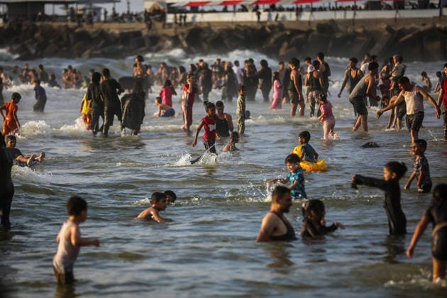 Palestinians flock to the coastline seeking relief from the heat GAZA CITY, GAZA, PALESTINE - JULY 03: As Israel s attacks on the Gaza Strip continues and soaring temperatures intensifies already harsh living conditions, Palestinians flock to the coastline seeking relief in Gaza City, Gaza, Palestine on July 03, 2026. Escaping the sweltering heat inside their tents, many sought relief by swimming off the coast of Gaza City, hoping to cool off and briefly escape the hardships of war. Saeed M. M. T. Jaras Anadolu Gaza City Gaza. Editorial use only. Please get in touch for any other usage.  Copyright: x2026xAnadoluxSaeedxM.xM.xT.xJarasx