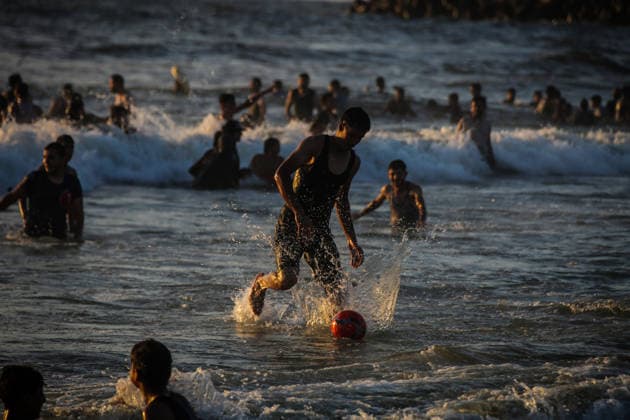 Palestinians flock to the coastline seeking relief from the heat GAZA CITY, GAZA, PALESTINE - JULY 03: As Israel s attacks on the Gaza Strip continues and soaring temperatures intensifies already harsh living conditions, Palestinians flock to the coastline seeking relief in Gaza City, Gaza, Palestine on July 03, 2026. Escaping the sweltering heat inside their tents, many sought relief by swimming off the coast of Gaza City, hoping to cool off and briefly escape the hardships of war. Saeed M. M. T. Jaras Anadolu Gaza City Gaza. Editorial use only. Please get in touch for any other usage.  Copyright: x2026xAnadoluxSaeedxM.xM.xT.xJarasx
