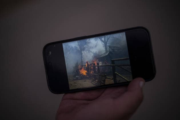Spain battles major Costa Brava wildfire after 1,800 hectares burn LA BISBAL D’EMPORDA, SPAIN - JULY 03: A person shows a photo of damaged property as a wildfire tears through the ecologically sensitive Les Gavarres mountain range in the Baix Emporda district of Catalonia, Spain, on July 3, 2026. A wildfire that broke out on Friday in the Baix Emporda district on Spain s Costa Brava has forced tens of thousands of people to remain indoors and has burned around 1,800 hectares, according to preliminary figures from regional authorities, as firefighters continue efforts to bring the blaze under control. Fanned by strong tramontana winds, the fire is affecting mainly the Les Gavarres mountain range, an area of high ecological value. Catalonia s  Copyright: x2026xAnadoluxLorenaxSopenaxLopezx