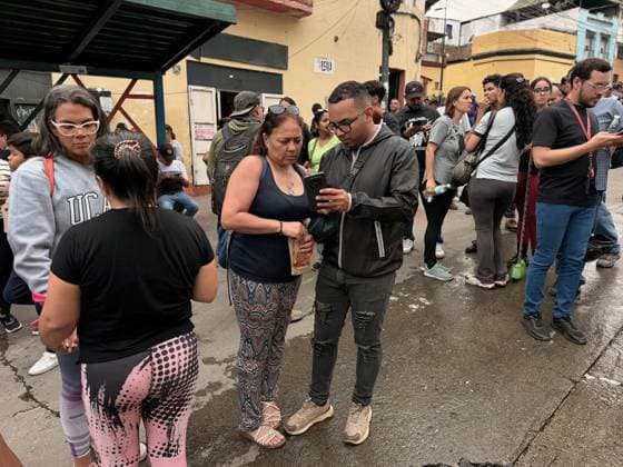 One person injured after partial collapse of school building in La Pastora, Venezuela CARACAS, VENEZUELA - JULY 3: Several people are standing in the street, looking concerned and astonished as they observe the scene of the collapse at San Judas Tadeo High School in La Pastora, Caracas, Venezuela, on July 3, 2026. A young woman nervously bites her nails while another woman beside her stares intently at the rubble. Part of the Agustiniano San Judas Tadeo School building, collapsed on the afternoon of Friday, nine days after the country was struck by a double earthquake. Although the building had been evacuated due to severe damage, one person was injured. Julio Urribarri Anadolu Caracas Venezuela. Editorial use only. Please get in touch fo  Copyright: x2026xAnadoluxJulioxUrribarrix