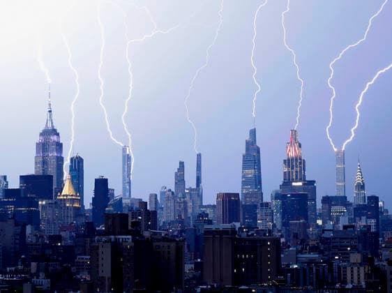 Bolts of lightning fill the Manhattan skyline and strike multiple skyscrapers including the Empire State Building and One Vanderbil in an early evening thunderstorm one day before the July 4th holiday and the 250th anniversary of the United States on Friday July 3, 2026 in New York City.  NYP202607033008 JOHNxANGELILLO
