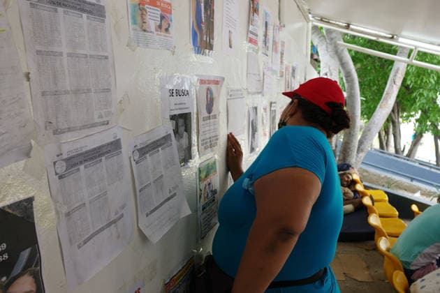 (260704) -- LA GUAIRA, July 4, 2026 -- A woman looks for information about her relatives missing in the earthquakes in Caraballeda, La Guaira state, Venezuela, July 3, 2026. The death toll from the twin earthquakes that struck Venezuela on June 24 has risen to 2,645, and 12,666 people were injured, Venezuelan National Assembly President Jorge Rodriguez said on Friday. ) (SpotNews) VENEZUELA-LA GUAIRA-EARTHQUAKES-DEATH TOLL ZhuxYubo 