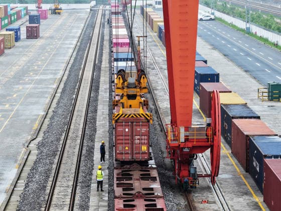 YANGZHOU, CHINA - JULY 04: A freight train loads containers at the Jiangdu railway special line logistics base on July 4, 2026 in Yangzhou, Jiangsu Province of China. China s state railway completed a freight volume of over 2 billion tons in the first half of 2026.  Copyright: xVCGx 111652158881