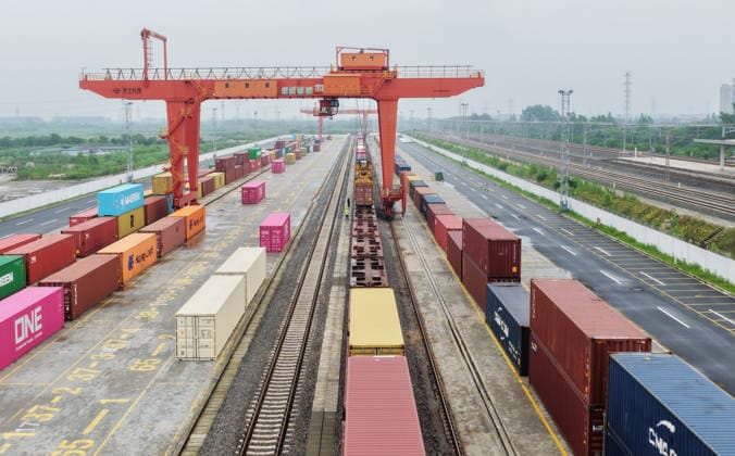 YANGZHOU, CHINA - JULY 04: Freight trains load containers at the Jiangdu railway special line logistics base on July 4, 2026 in Yangzhou, Jiangsu Province of China. China s state railway system completed a freight volume exceeding 2 billion tons in the first half of 2026.  Copyright: xVCGx 111652158882