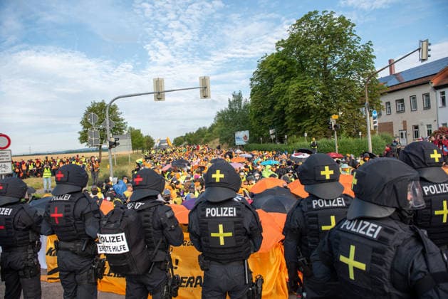 Mass demonstrations accompany AfD party congress in eastern Germany ERFURT, GERMANY - JULY 4: Protesters block the roads leading to the Messe Erfurt exhibition grounds during demonstrations against the federal party congress of the Alternative for Germany (AfD) in Erfurt, Germany, on July 4, 2026. Around 8:30 a.m., demonstrators established approximately nine coordinated blockades, occupying all major access routes to the congress venue in an attempt to prevent AfD delegates from reaching the event. More than police officers were deployed to secure the congress, clear blockades and maintain access to the venue. The AfD is a right-wing populist political party whose positions on immigration and national identity have made it one of Germany s  Copyright: x2026xAnadoluxMouafakxMahmaljix