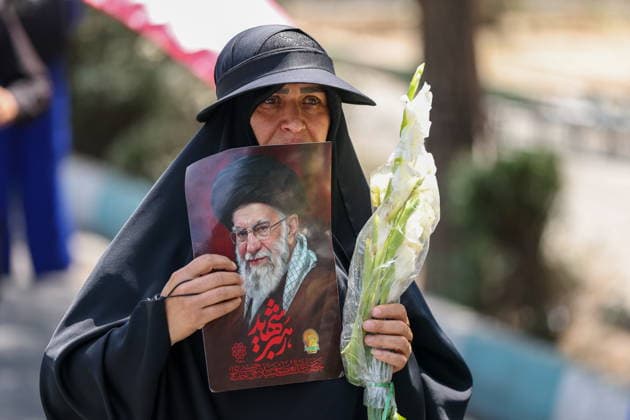 IRAN, TEHRAN - JULY 4, 2026: A woman holds a portrait outside the Grand Mosalla of Tehran (Imam Khomeini Mosalla of Tehran) ahead of the state funeral of Iranian Supreme Leader Ayatollah Ali Khamenei. Khamenei was killed in a joint US-Israeli airstrike on February 28. Valery Sharifulin TASS  94646275