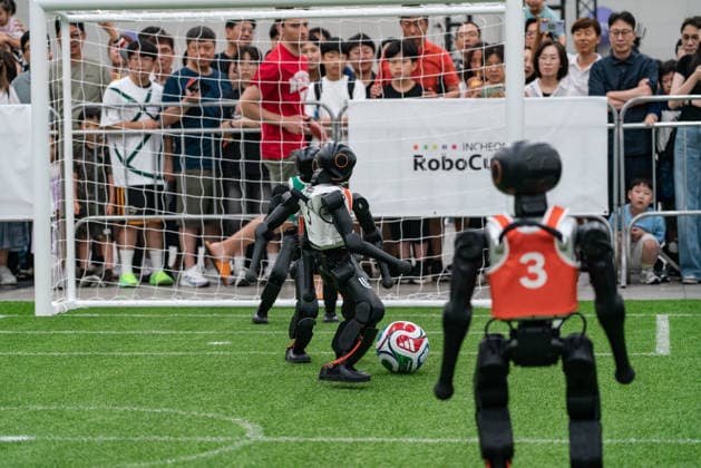 RoboCup 2026 in Incheon, South Korea - 04 Jul 2026 Humanoid robots seen playing soccer for the Humanoid soccer league at Songdo ConvensiA. RoboCup 2026 INCHEON is happening from July 2 to July 6 at Songdo ConvensiA. The event was first held in 1997 and is the world’s largest robot soccer competition and a global challenge dedicated to build a better future through artificial intelligence and robotic technologies. Incheon South Korea Copyright: xSimonxShinx xSOPAxImagesx _DSC5457